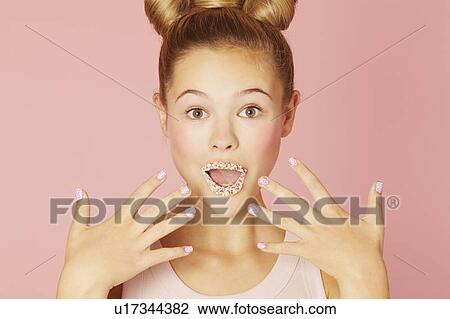Teenage girl wearing colorful lipstick View Large Photo Image Stock Image - Teenage girl wearing colorful lipstick. Fotosearch