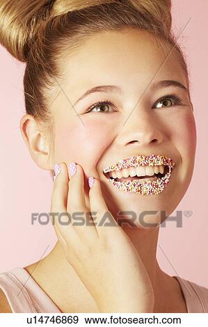 Teenage girl wearing colorful lipstick View Large Photo Image Stock Photo - Teenage girl wearing colorful lipstick. Fotosearch