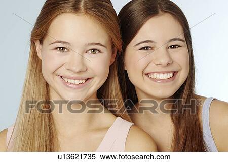 Stock Photography - Teenage girls smiling together. Fotosearch