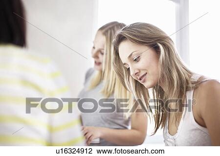 Teenage girls studying together View Large Photo Image Stock Image - Teenage girls studying together. Fotosearch