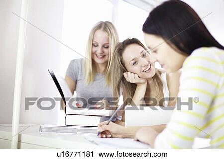 Teenage girls studying together View Large Photo Image Stock Image - Teenage girls studying together. Fotosearch