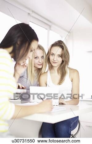 Teenage girls studying together View Large Photo Image Stock Image - Teenage girls studying together. Fotosearch