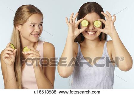 Teenage girls with cucumbers over eyes View Large Photo Image Stock Photo - Teenage girls with cucumbers over eyes. Fotosearch