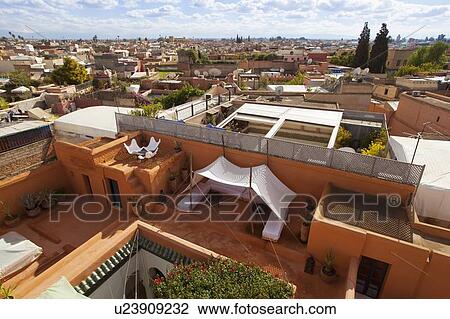 Stock Image - Terrace and Marrakesh cityscape. Fotosearch