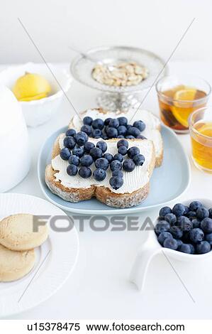 Toast with blueberries, nuts and tea View Large Photo Image Stock Photography - Toast with blueberries, nuts and tea. Fotosearch