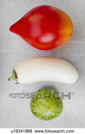 Stock Photo - Tomato varieties with white eggplant. Fotosearch