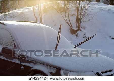 Windshield wipers on snow-covered car View Large Photo Image Picture - Windshield wipers on snow-covered car. Fotosearch