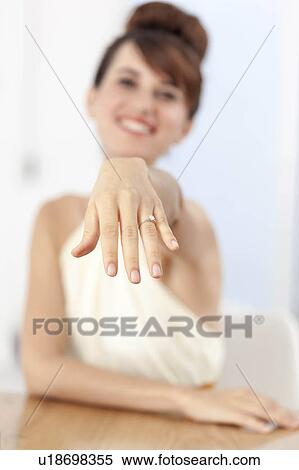Woman displaying engagement ring View Large Photo Image Stock Photography - Woman displaying engagement ring. Fotosearch