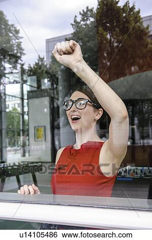 Woman knocking on window View Large Photo Image Stock Photograph - Woman knocking on window. Fotosearch