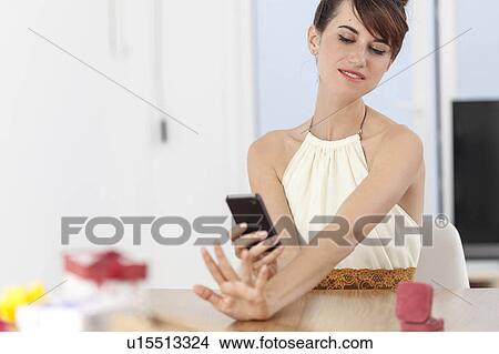 Woman taking picture of engagement ring View Large Photo Image Picture - Woman taking picture of engagement ring. Fotosearch
