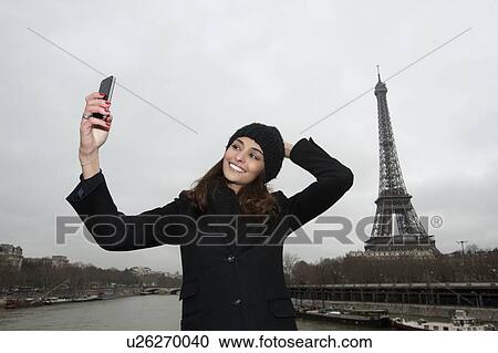 Woman taking picture with cell phone View Large Photo Image Stock Image - Woman taking picture with cell phone. Fotosearch
