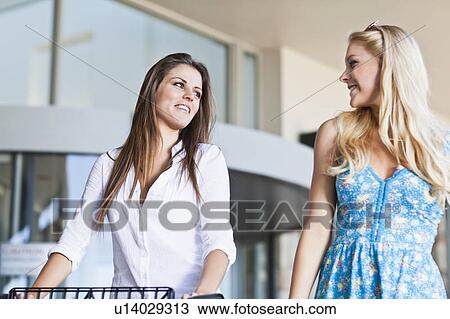 Women shopping together View Large Photo Image Stock Image - Women shopping together. Fotosearch