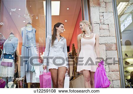 Women shopping together View Large Photo Image Stock Photo - Women shopping together. Fotosearch