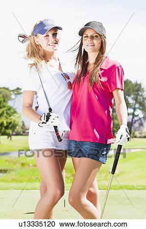 Women smiling together on golf course View Large Photo Image Stock Image - Women smiling together on golf course. Fotosearch