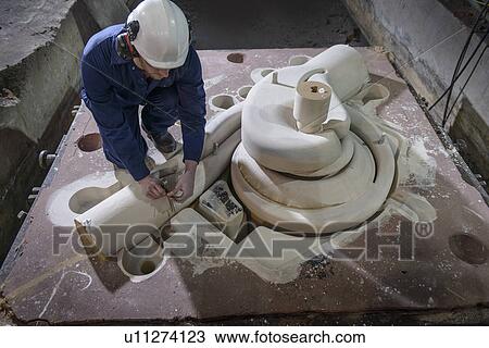 Worker inspecting mould in metal foundry View Large Photo Image Stock Image - Worker inspecting mould in metal foundry. Fotosearch
