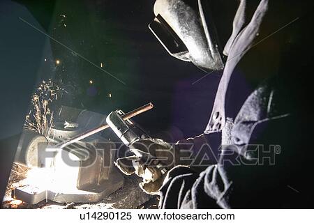 Worker welding metal in foundry View Large Photo Image Stock Photography - Worker welding metal in foundry. Fotosearch