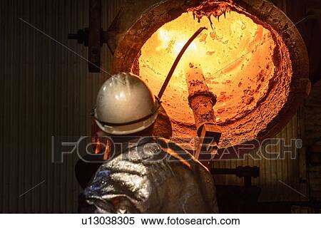 Workers cleaning metal flask in factory View Large Photo Image Stock Photography - Workers cleaning metal flask in factory. Fotosearch