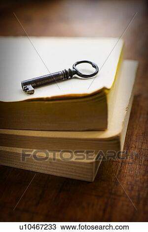 Antique book and key View Large Photo Image Stock Image - Antique book and key. Fotosearch
