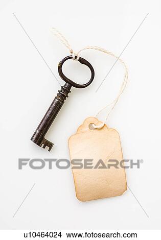 Picture - Antique key with tag. Fotosearch