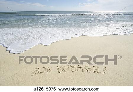 Stock Photograph - Bon Voyage' note on sand. Fotosearch