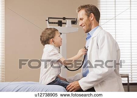 Boy (2-3) listening heartbeat of pediatrician View Large Photo Image Stock Photography - Boy (2-3) listening heartbeat of pediatrician. Fotosearch