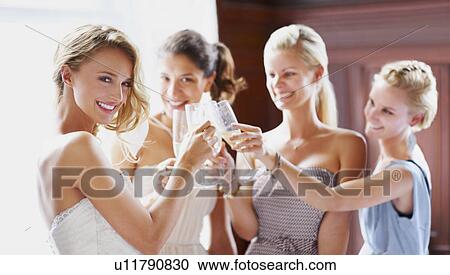 Bride and bridesmaids toasting View Large Photo Image Stock Image - Bride and bridesmaids toasting. Fotosearch