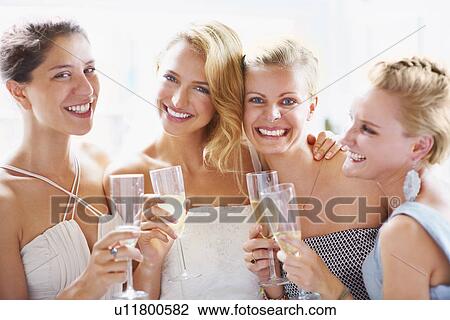 Bride and bridesmaids toasting View Large Photo Image Stock Image - Bride and bridesmaids toasting. Fotosearch