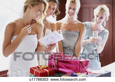 Bride and bridesmaids unpacking gifts View Large Photo Image Stock Image - Bride and bridesmaids unpacking gifts. Fotosearch