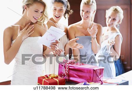 Bride and bridesmaids unpacking gifts View Large Photo Image Stock Photo - Bride and bridesmaids unpacking gifts. Fotosearch