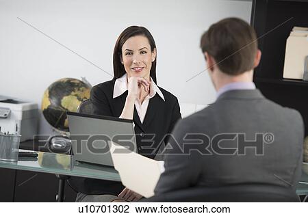 Businesswoman talking to businessman View Large Photo Image Stock Image - Businesswoman talking to businessman. Fotosearch