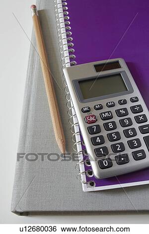 Calculator, textbook, pencil and notebook, studio shot View Large Photo Image Stock Photograph - Calculator, textbook, pencil and notebook, studio shot. Fotosearch
