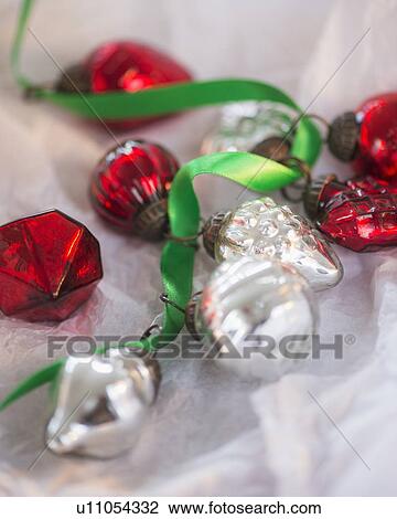 Christmas baubles wrapped in paper View Large Photo Image Stock Image - Christmas baubles wrapped in paper. Fotosearch