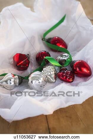 Christmas baubles wrapped in paper View Large Photo Image Stock Photo - Christmas baubles wrapped in paper. Fotosearch