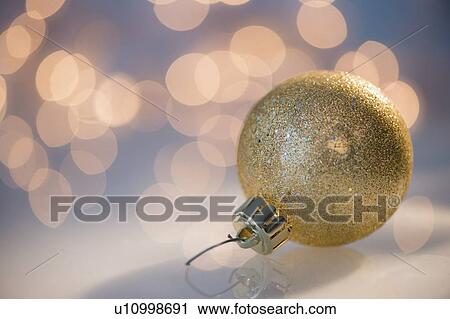 Close-up of gold christmas ornament View Large Photo Image Stock Image - Close-up of gold christmas ornament . Fotosearch
