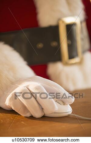 Close-up of santa claus using computer View Large Photo Image Stock Photo - Close-up of santa claus using computer. Fotosearch