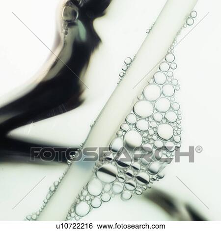 Stock Photograph - Close-up of water in spray bottle. Fotosearch