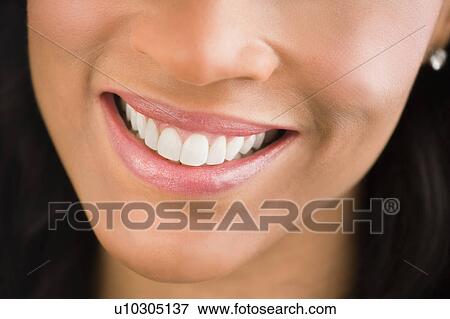 Stock Photo - Close-up of woman smiling. Fotosearch
