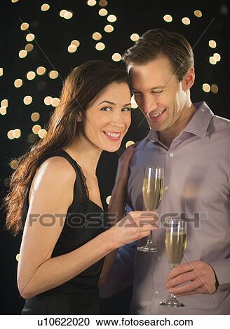 Couple celebrating new year's eve View Large Photo Image Stock Image - Couple celebrating new year's eve. Fotosearch