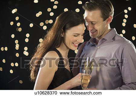 Couple celebrating new year's eve View Large Photo Image Stock Image - Couple celebrating new year's eve. Fotosearch