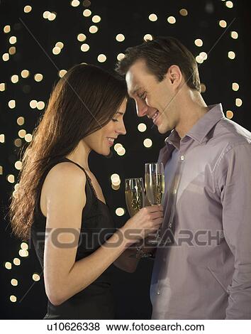 Couple celebrating new year's eve View Large Photo Image Stock Photo - Couple celebrating new year's eve. Fotosearch