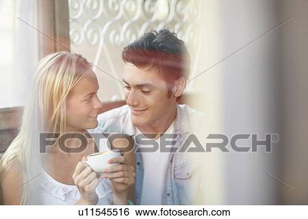 Couple drinking tea in cafe View Large Photo Image Stock Photograph - Couple drinking tea in cafe. Fotosearch