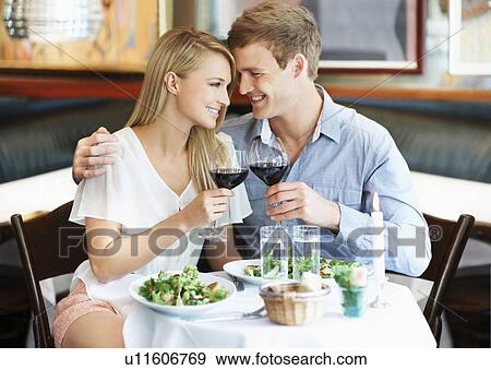 Couple drinking wine in restaurant View Large Photo Image Stock Photo - Couple drinking wine in restaurant. Fotosearch