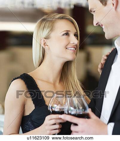 Couple drinking wine in restaurant View Large Photo Image Stock Photo - Couple drinking wine in restaurant. Fotosearch