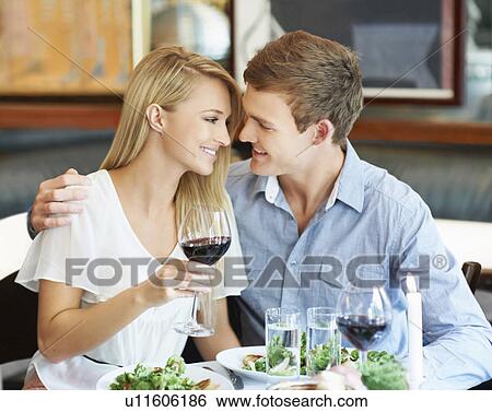 Couple drinking wine in restaurant View Large Photo Image Stock Photograph - Couple drinking wine in restaurant. Fotosearch