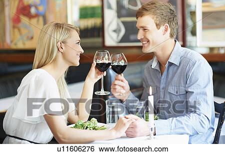 Couple drinking wine in restaurant View Large Photo Image Stock Photograph - Couple drinking wine in restaurant. Fotosearch