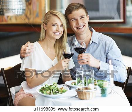 Couple drinking wine in restaurant View Large Photo Image Stock Photography - Couple drinking wine in restaurant. Fotosearch