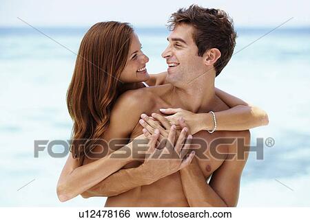 Stock Photograph - Couple enjoying summer holidays. Fotosearch