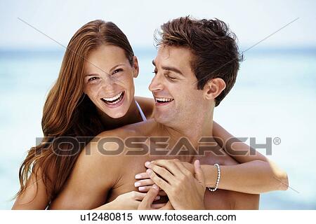 Couple enjoying summer holidays View Large Photo Image Stock Photography - Couple enjoying summer holidays. Fotosearch