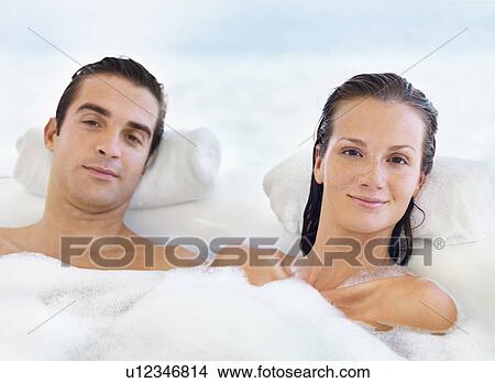 Picture - Couple relaxing in bathtub. Fotosearch