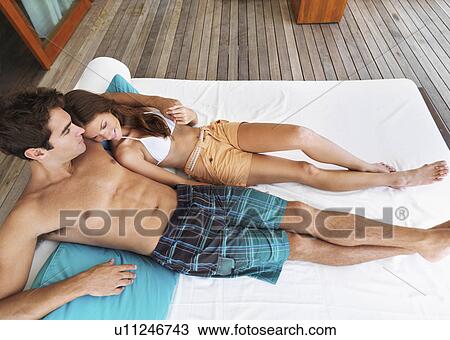 Elevated portrait of couple relaxing View Large Photo Image Stock Image - Elevated portrait of couple relaxing. Fotosearch